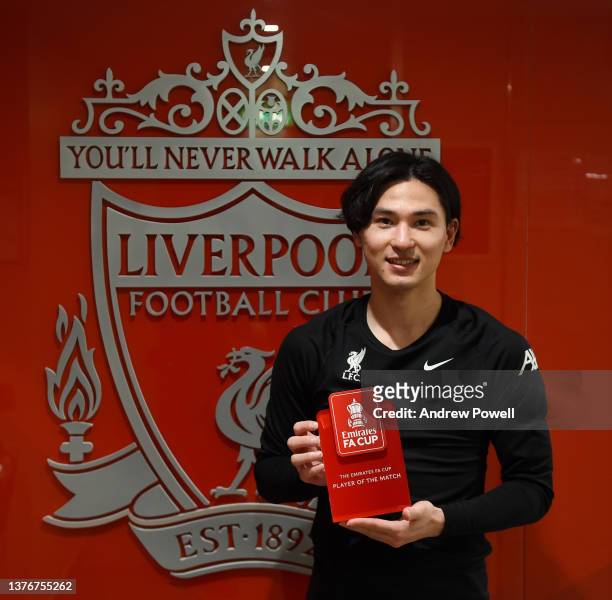 Takumi Minamino of Liverpool with the player of the match award at the end of the Emirates FA Cup Fifth Round match between Liverpool and Norwich...