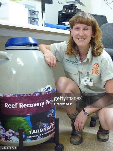 Reproductive biologist Tamara Keeley with the 'Reef Recovery Project' chamber, full of frozen coral sperm and egg samples and embryos at Dubbo's...