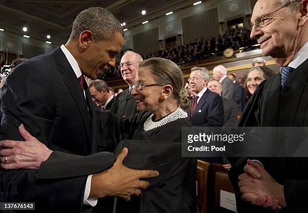President Barack Obama greets Supreme Court Justice Ruth Bader Ginsburg before his State of the Union address before a joint session of Congress on...