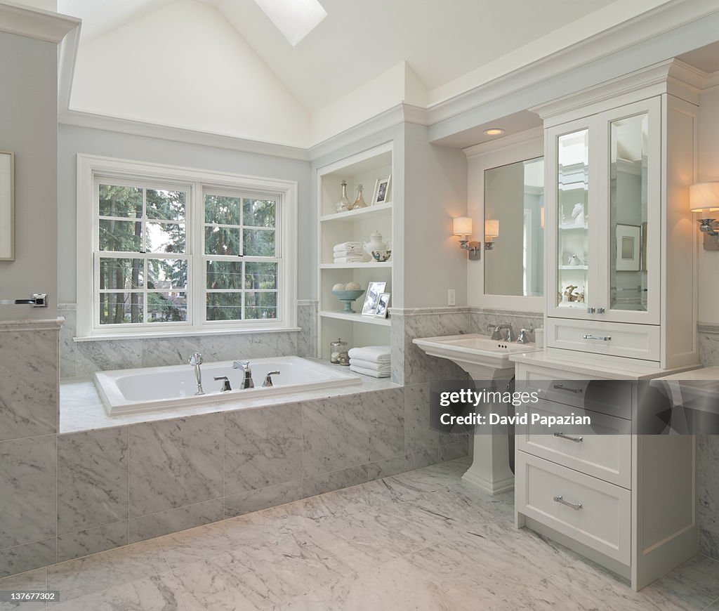 Master bathroom with marble and custom trim.