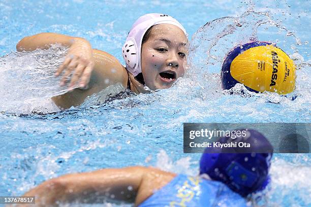 Shino Magariyama of Japan controls the ball against Anna Zubkova of Kazakhstan during the Asian Water Polo Championships 2012 match between Japan and...