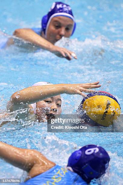 Shino Magariyama of Japan controls the ball against Anna Zubkova of Kazakhstan during the Asian Water Polo Championships 2012 match between Japan and...