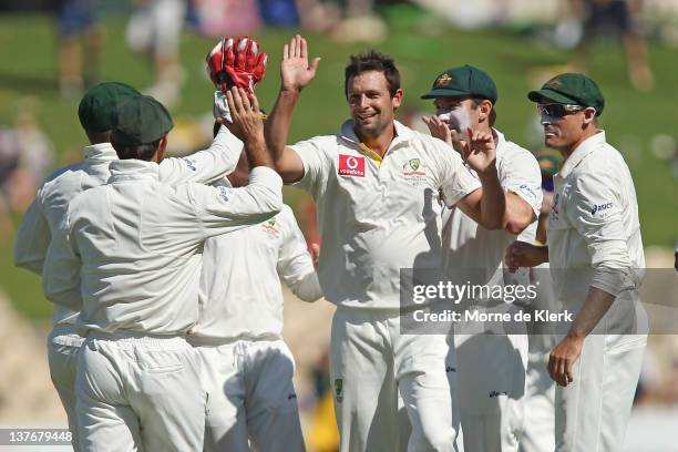 Ben Hifenhaus of Australia celebrates with team mates after getting the wicket of Rahul Dravid of India during day two of the Fourth Test Match...