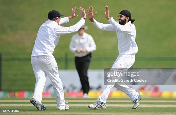 Monty Panesar of England celebrates with Graeme Swann dismissing Mohammad Hafeez of Pakistan during the second Test match between Pakistan and...