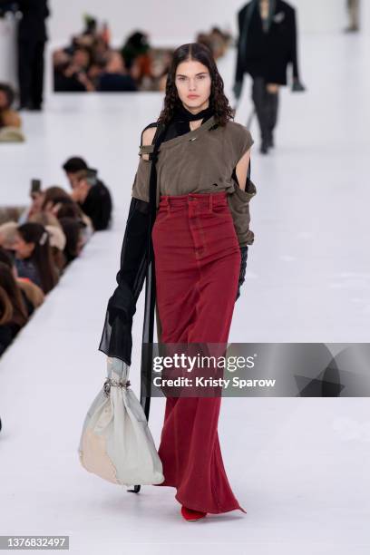 Model walks the runway during the Acne Studios Womenswear Fall/Winter 2022/2023 show as part of Paris Fashion Week on March 02, 2022 in Paris, France.