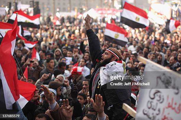 Egyptians gather in Tahrir Square to mark the one year anniversary of the revolution on January 25, 2012 in Cairo Egypt. Tens of thousands are...