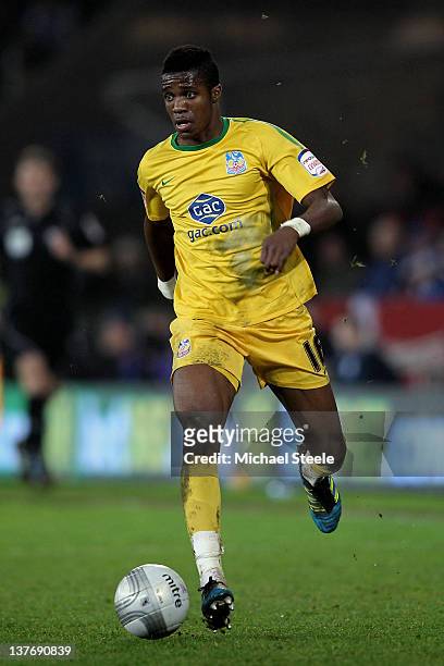 Wilfried Zaha of Crystal Palace runs with the ball during the Carling Cup Semi Final second leg match between Cardiff City and Crystal Palace at...