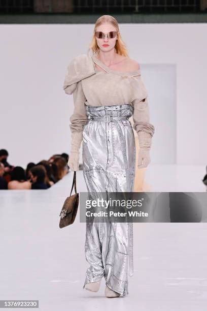 Model walks the runway during the Acne Studios Womenswear Fall/Winter 2022/2023 show as part of Paris Fashion Week on March 02, 2022 in Paris, France.