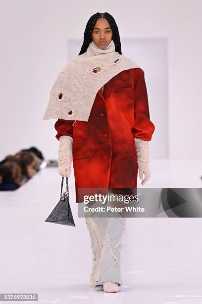 Model walks the runway during the Acne Studios Womenswear Fall/Winter 2022/2023 show as part of Paris Fashion Week on March 02, 2022 in Paris, France.