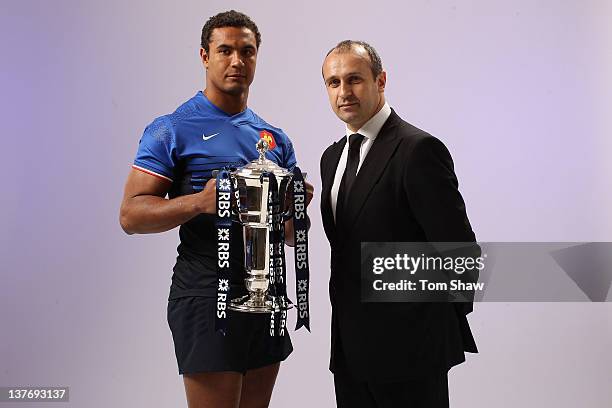 Thierry Dusautoir of France and Head Coach Philippe Saint-Andre of France pose with the RBS Six Nations trophy during the RBS Six Nations Launch at...