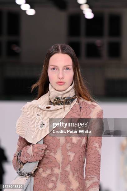 Model walks the runway during the Acne Studios Womenswear Fall/Winter 2022/2023 show as part of Paris Fashion Week on March 02, 2022 in Paris, France.