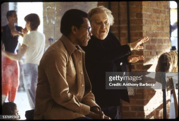 American dancer Agnes DeMille and Arthur Mitchell discuss choreography at the Dance Theatre of Harlem, New York, New York, 1983.