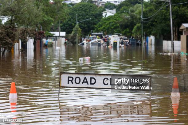 Road closed sign in a flooded Vincent Street, Auchenflower on March 03, 2022 in Brisbane, Australia. From Brisbane in Queensland to Lismore in...