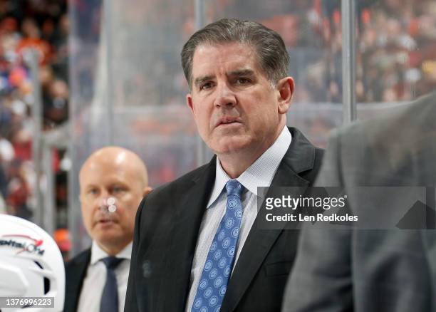 Head Coach of the Washington Capitals Peter Laviolette watches the play on the ice from his bench against the Philadelphia Flyers at the Wells Fargo...