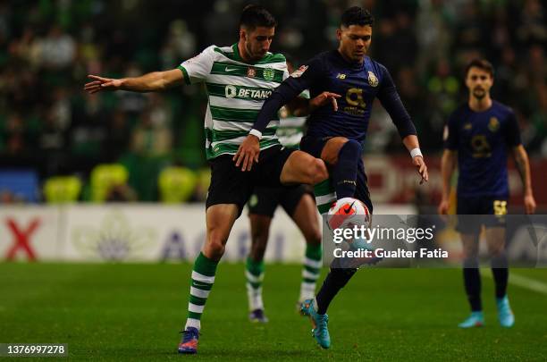 Evanilson of FC Porto with Goncalo Inacio of Sporting CP in action during the Portuguese Cup Semifinal match between Sporting CP and FC Porto at...