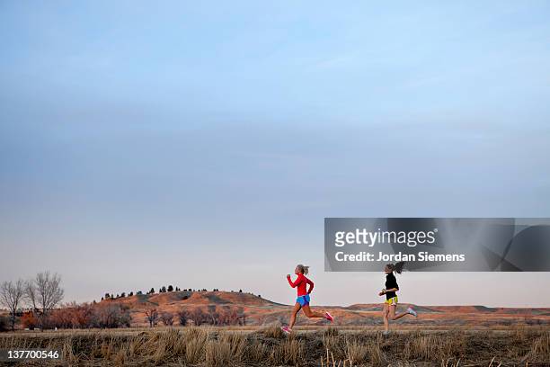 two females running together. - billings bildbanksfoton och bilder