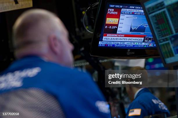 Traders work during the Federal Reserve Federal Open Market Committee rate decision on the floor of the New York Stock Exchange in New York, U.S., on...