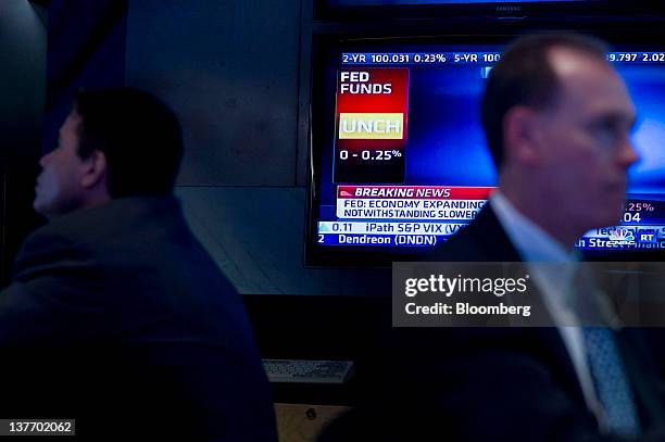 Traders work during the U.S. Federal Reserve Federal Open Market Committee rate decision on the floor of the New York Stock Exchange in New York,...