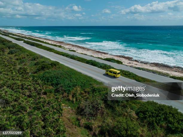 aerial view of  car on road on cozumel island near playa del carmen at sunset - cozumel mexico stock pictures, royalty-free photos & images