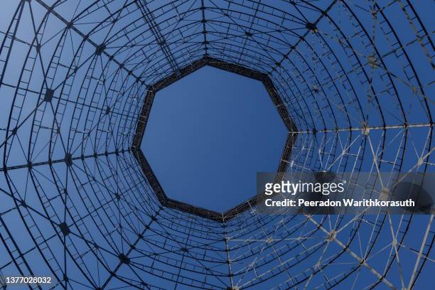 interior view of gasometer, existing structure against blue sky. - mining low angle foto e immagini stock