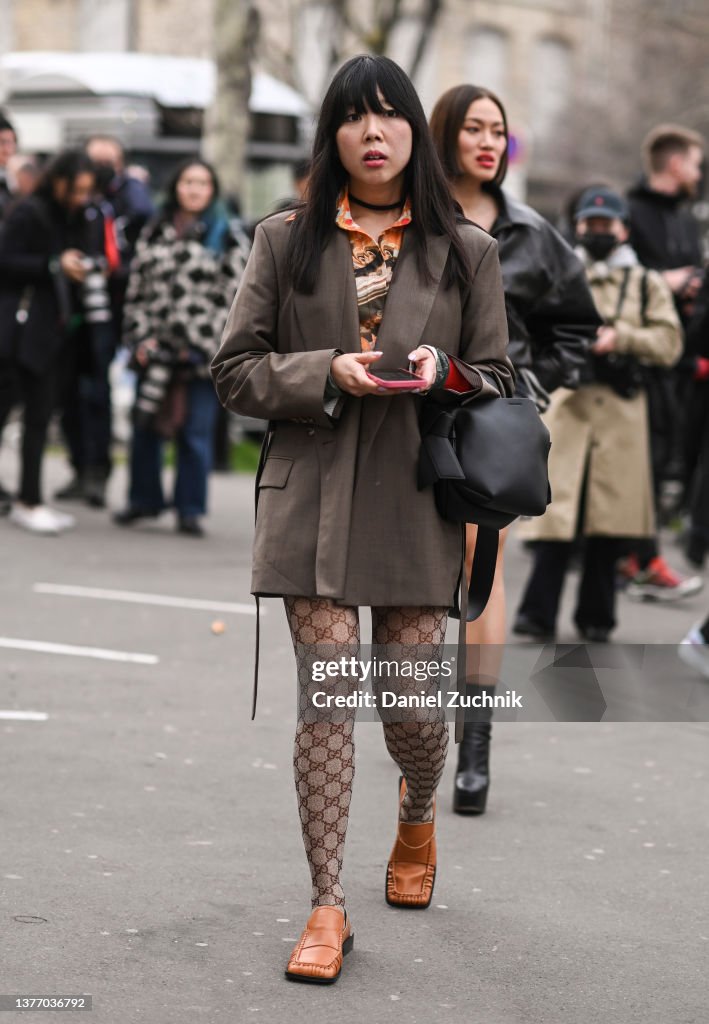 Susie Lau is seen wearing a brown blazer and Gucci stockings and... News Photo - Images