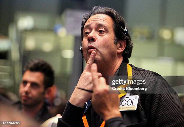 Trader works in the S&P 500 pit on the floor of the CME Group's Chicago Board of Trade prior to the Federal Reserve Federal Open Market Committee...