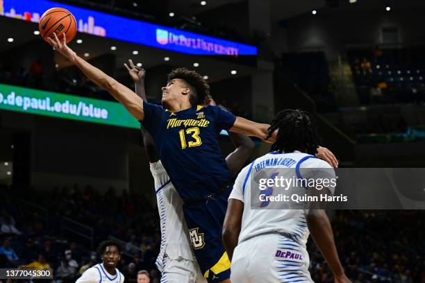 Oso Ighodaro of the Marquette Golden Eagles shoots in the first half against the DePaul Blue Demons at Wintrust Arena on March 02, 2022 in Chicago,...