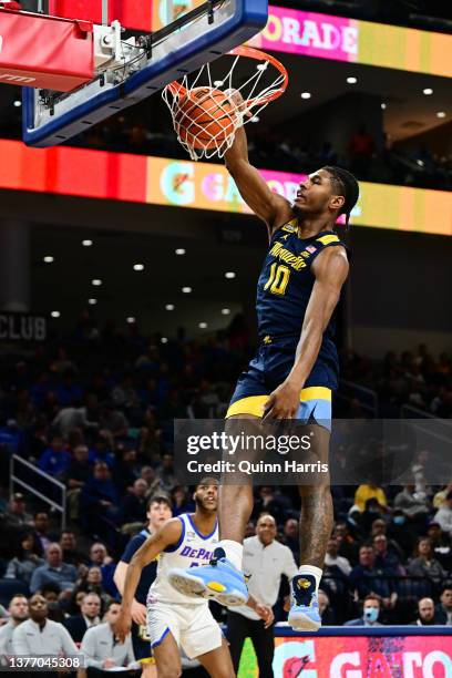 Justin Lewis of the Marquette Golden Eagles dunks in the first half against the DePaul Blue Demonsat Wintrust Arena on March 02, 2022 in Chicago,...