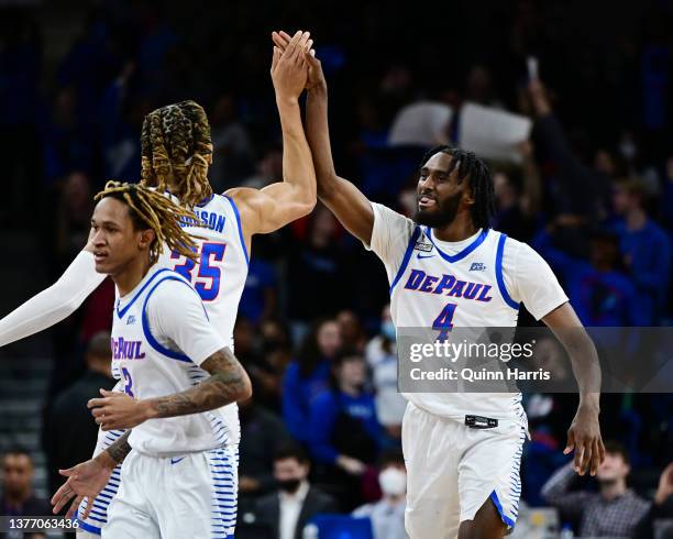 Javon Freeman-Liberty and Brandon Johnson of the DePaul Blue Demons reacts after scoring in the second half against the Marquette Golden Eagles at...