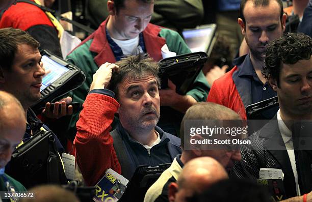 Traders monitor prices in the Standard & Poor's 500 stock index options pit at the Chicago Board Options Exchange following the Federal Open Market...