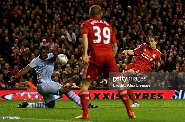 Micah Richards of Manchester City handballs to concede a penalty during the Carling Cup Semi Final Second Leg match between Liverpool and Manchester...