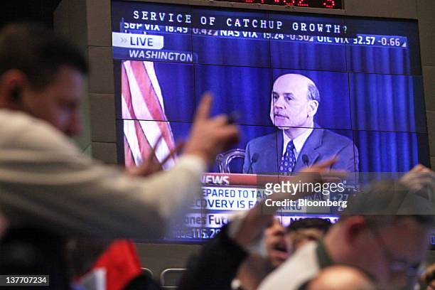 Monitor displays Ben S. Bernanke, chairman of the U.S. Federal Reserve, while traders work in the two-year and five-year U.S. Treasury Note options...