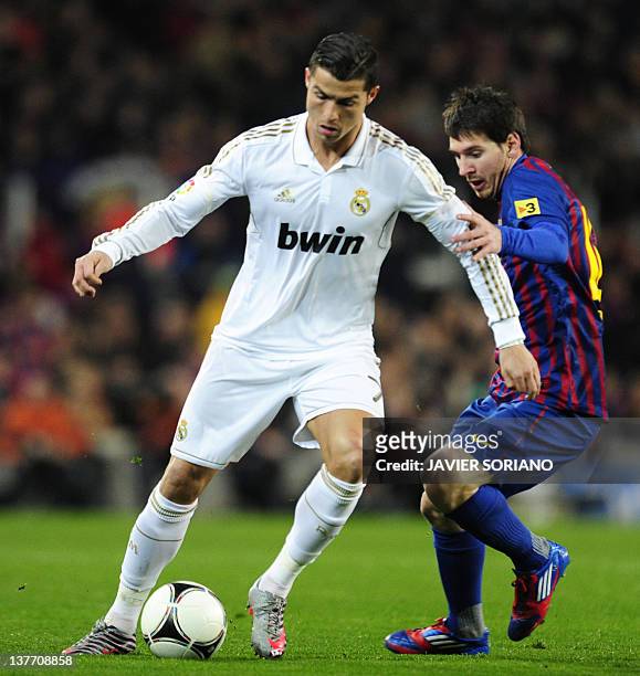 Barcelona's Argentinian forward Lionel Messi vies with Real Madrid's Portuguese forward Cristiano Ronaldo during the second leg of the Spanish Cup...