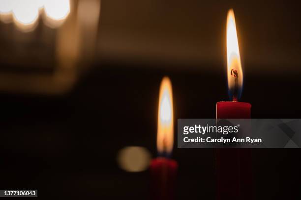 pair of red taper candles at a restaurant for romantic dinner - wachs stock-fotos und bilder