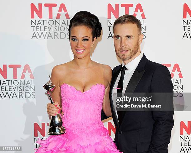 Tulisa Contostavlos and Gary Barlow pose with their best Talent Show Award for X-Factor at National Television Awards 2012 held at the O2 Arena on...