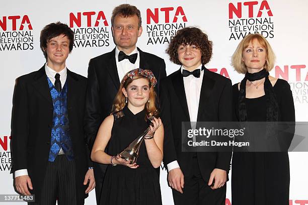 Hugh Dennis, Tyger Drew Honey, Ramona Marquez, Daniel Roache and Claire Skinner of Outnumbered pose with their Situation Comedy Award in the press...