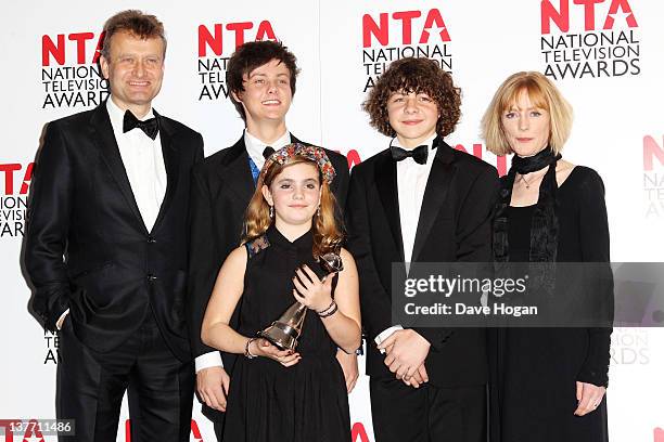 Hugh Dennis, Tyger Drew Honey, Ramona Marquez, Daniel Roache and Claire Skinner of Outnumbered pose with their Situation Comedy Award in the press...