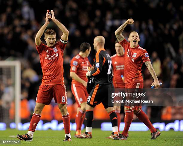 Steven Gerrard and Martin Skrtel of Liverpool celebrate at the end of the Carling Cup Semi Final Second Leg match between Liverpool and Manchester...