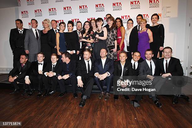 The cast and crew of Coronation Street pose with their Serial Drama Award in the press room at the National Television Awards 2012 at The O2 Arena on...