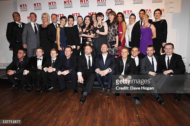 The cast and crew of Coronation Street pose with their Serial Drama Award in the press room at the National Television Awards 2012 at The O2 Arena on...