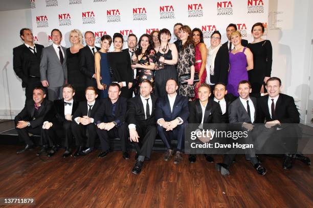 The cast and crew of Coronation Street pose with their Serial Drama Award in the press room at the National Television Awards 2012 at The O2 Arena on...