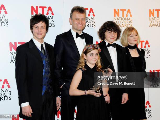 Winners of Situation Comedy Tyger Drew-Honey, Hugh Dennis, Ramona Marquez, Daniel Roche and Claire Skinner pose in front of the winners boards during...