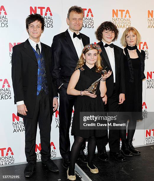 Winners of Situation Comedy Tyger Drew-Honey, Hugh Dennis, Ramona Marquez, Daniel Roche and Claire Skinner pose in front of the winners boards during...