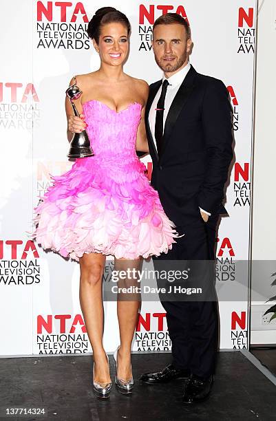 Tulisa Contostavlos and Gary Barlow pose in the press room at the National Television Awards 2012 at The O2 Arena on January 25th, 2012 in London,...