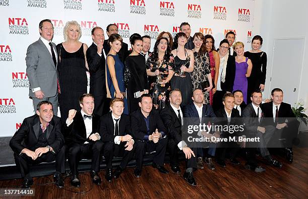 The cast and crew of Coronation Street pose in front of the winners boards after winning the Serial Drama Award during the National Television Awards...