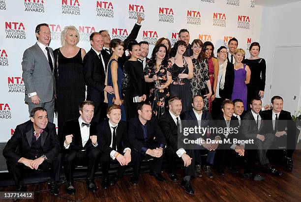 The cast and crew of Coronation Street pose in front of the winners boards after winning the Serial Drama Award during the National Television Awards...