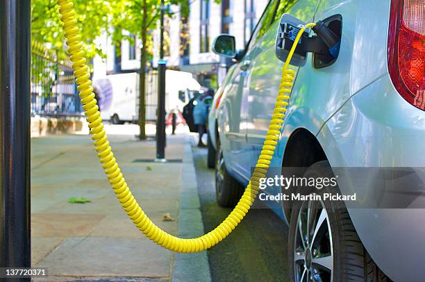 electric car street charging point - electric car charging stock pictures, royalty-free photos & images