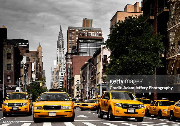 taxi's on lex - taxi stock pictures, royalty-free photos & images