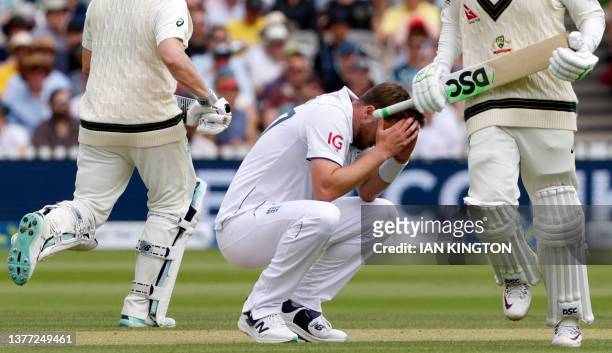 England's Ollie Robinson reacts as Australia's Usman Khawaja and Australia's Steven Smith take a run on day four of the second Ashes cricket Test...