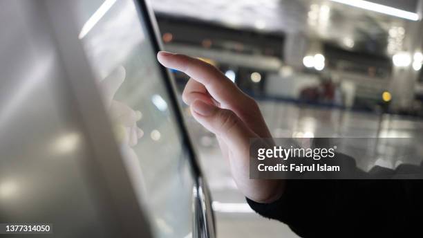 child's hand touching the screen - finger touchscreen stock-fotos und bilder